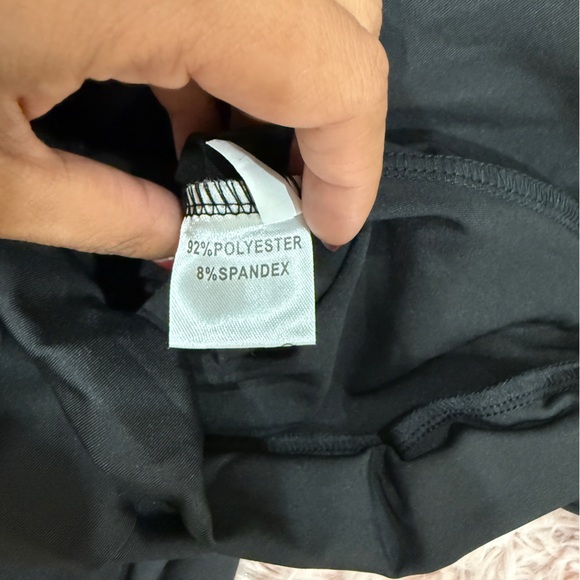 Sleek Black Jumpsuit with Plunging V-Neck and Long Sleeves - Picture 3 of 5